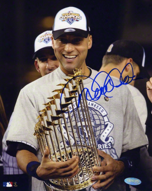 Derek Jeter Autographed Photograph  Details: New York Yankees, 8x10, Holding 2009 World Series Memorial of conquest